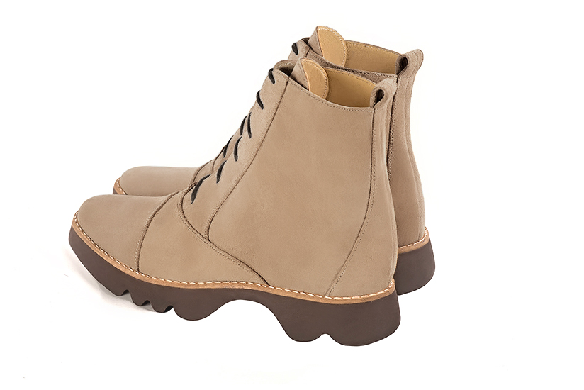 Tan beige women's ankle boots with laces at the front. Round toe. Flat rubber soles. Rear view - Florence KOOIJMAN